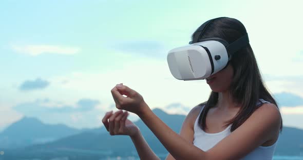 Woman watching though VR device 