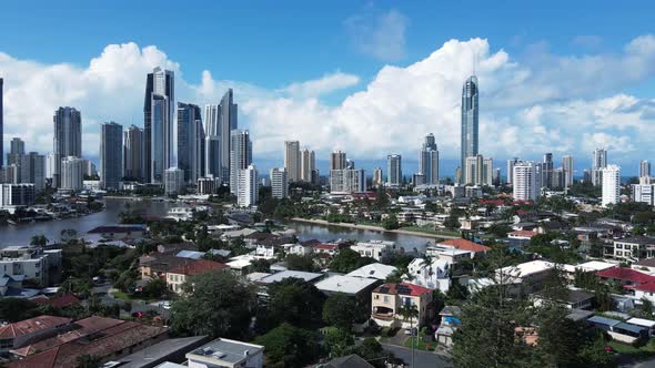 Unique aerial view of real estate property canal housing close to the towering Gold Coast Australia