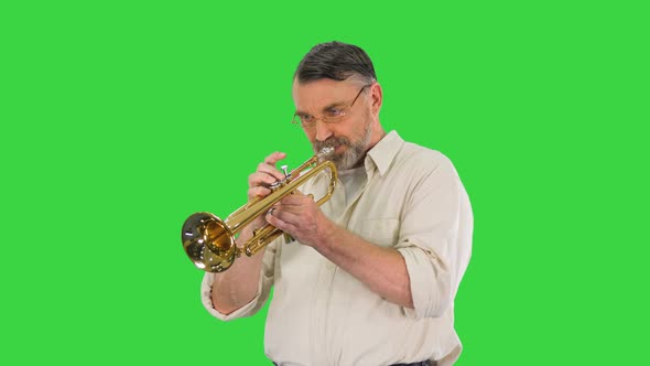 Senior Musician Playing a Trumpet on a Green Screen Chroma Key