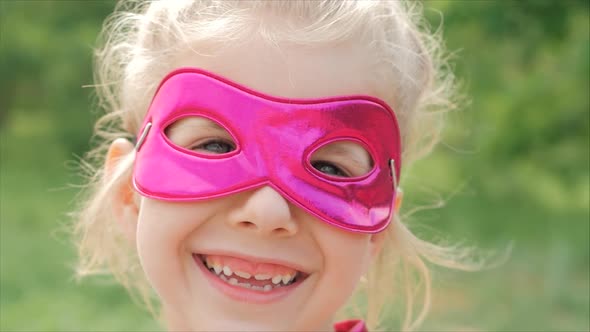 Beautiful Llittle Girl in the Superhero Costume, Close Up Portrait Child in the Mask of the Hero