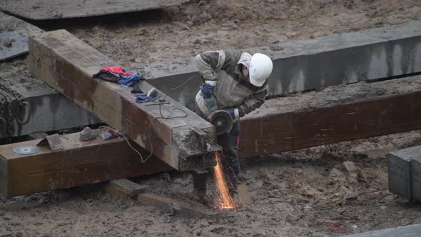 Angular Saw Grinding Through Construction Piles at Construction Site