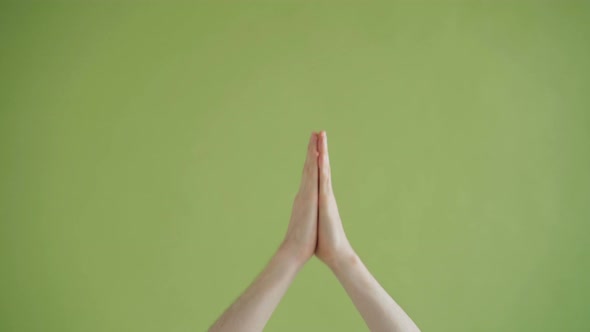 Close-up Shot of Human Male Hands Making Praying Gestures Crossing Fingers