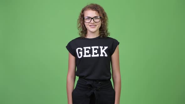 Young Happy Beautiful Nerd Woman Smiling with Arms Crossed