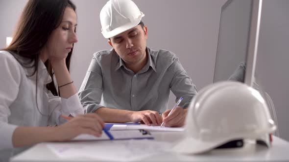 Two engineers working on the project.