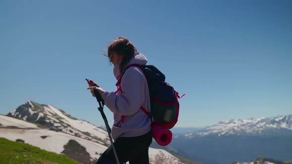 Woman Mountain Hiker Using Gps on Mobile Phone to Check the Route