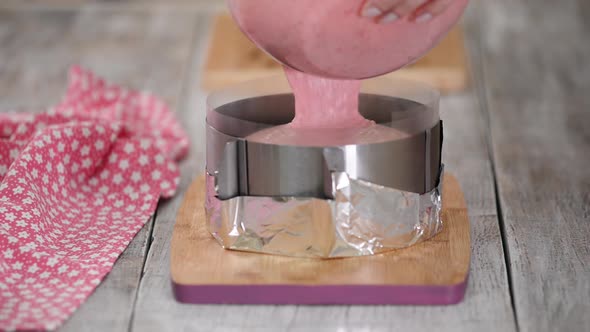 Pouring Berry Mousse Into Cooking Form. Step By Step French Mousse Cake Making Process.