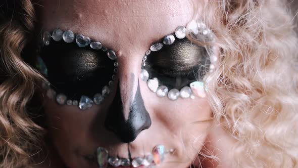 Closeup of Woman with Curly Hair and Extraordinary Makeup