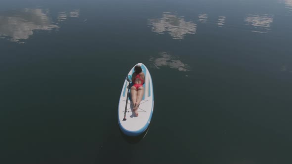 Tanning While Lying on Sup Board