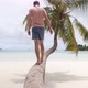 Man Resting On Palm Tree - VideoHive Item for Sale