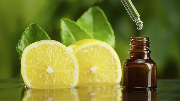 Dripping Lemon Juice From Pipette Into Bottle Closeup Vitamin Oil