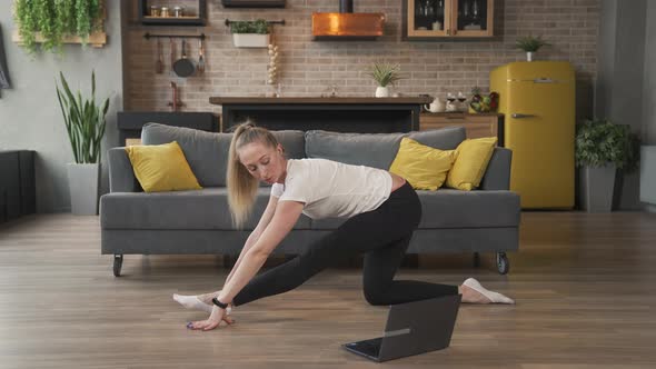 Woman Does Stretching Exercises