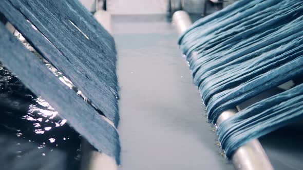 Fabric Strands are Getting Washed By a Factory Machine