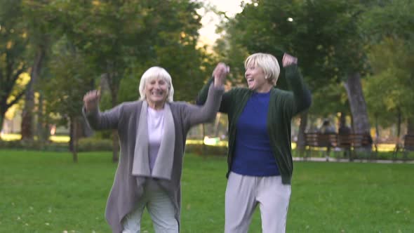 Middle-Age Women Jumping From Happiness