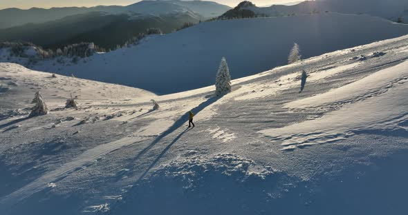 Fly Over and Around the Mountains of Ciucas Romania in January 2022 Sunny Day