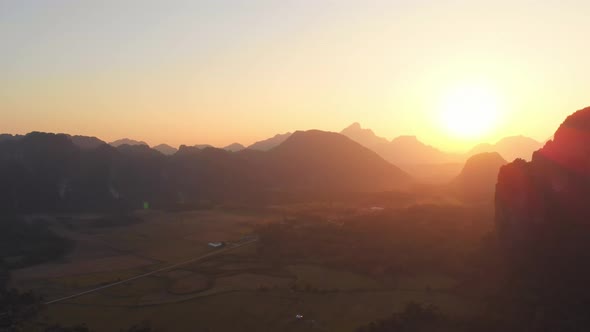 Aerial: Vang Vieng backpacker travel destination in Laos, Asia.