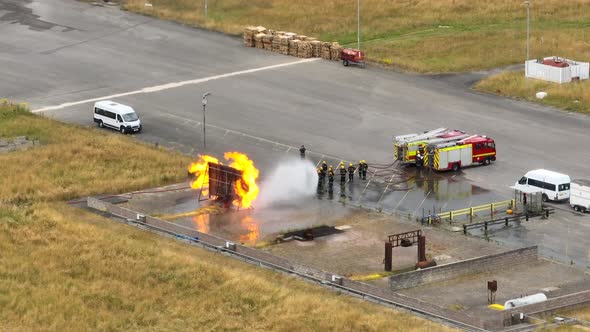 Firefighters Undergoing Training in a Mock Fire Response Emergency