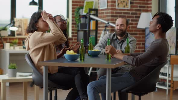 Group of Happy Friends Playing Board Games with Cards