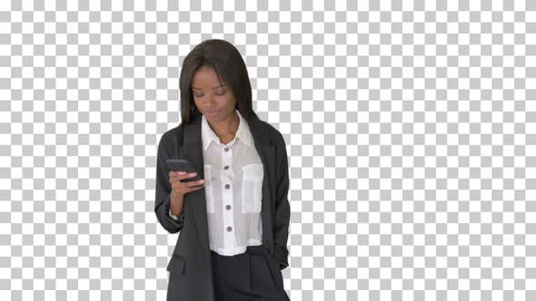 Smiling african american female texting, Alpha Channel