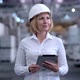 Follow Footage of Employees Famale Warehouse Worker Engineer in Hard Hat Working - VideoHive Item for Sale