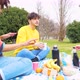 Four young students multiethnic friends outdoor doing pic nic - VideoHive Item for Sale