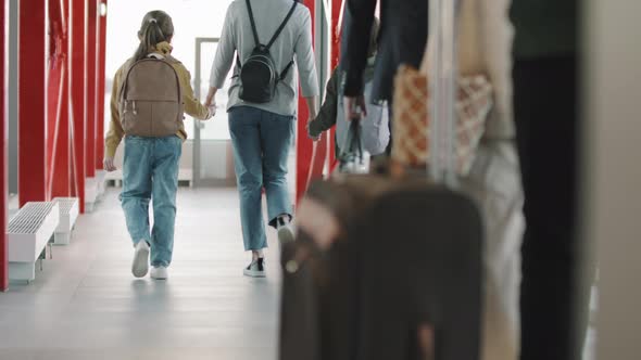 Passengers Boarding On Airplane