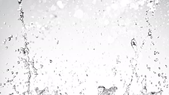 Super Slow Motion Shot of Water Splash on Light Grey Background at 1000Fps