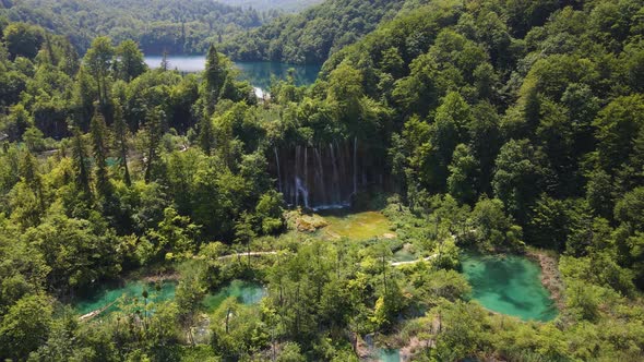 View of the Plitvice Lakes National Park with many green plants and beautiful lakes and waterfalls i