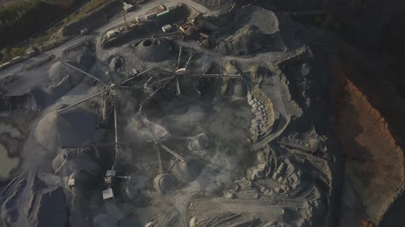 Big Crusher Working with Rubble at a Quarry Moving It on a Line