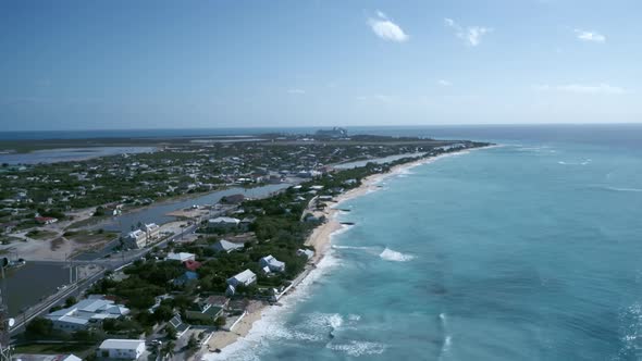 Drone camera flies to coast area of Cockburn Town, Grand Turk, Turks and Caicos
