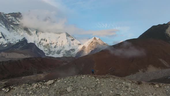 Lhotse South Face Mountain and Hiker Man at Sunset. Himalaya, Nepal. Aerial View