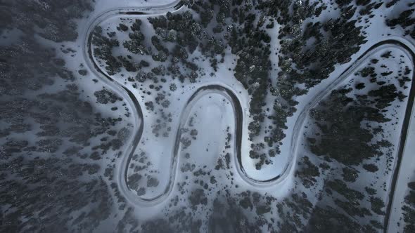 Drone view of evergreen winter forest and mountain road near Crater Lake, Oregon