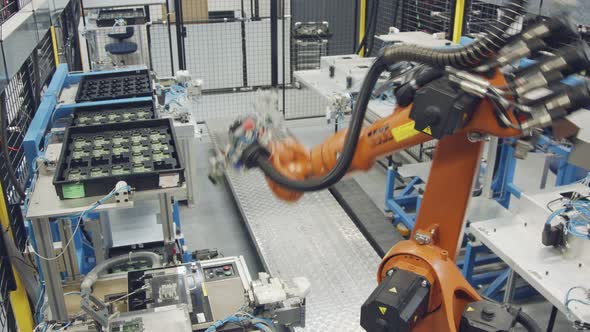 Robot working in an electronics manufacturing facility