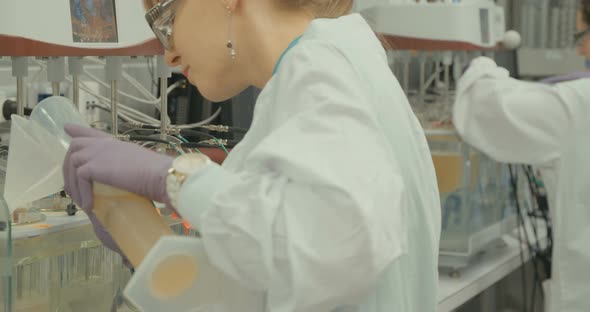 Scientist working in a pharmaceutical laboratory conducting experiments