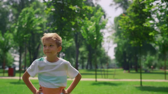 Portrait of Boy Looking Around Lawn Close Up