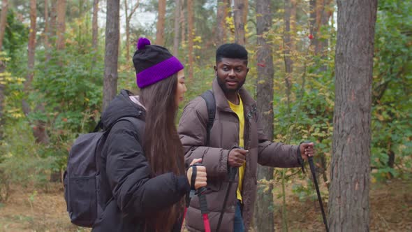 Hiking Man and Woman on Hike in Forest Trekking