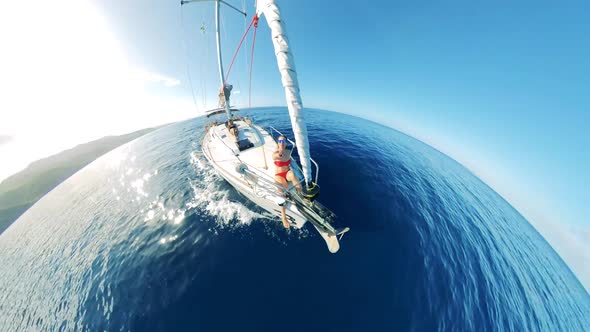 Semicircle Panorama of a Yacht with a Lady Onboard Crossing the Sea