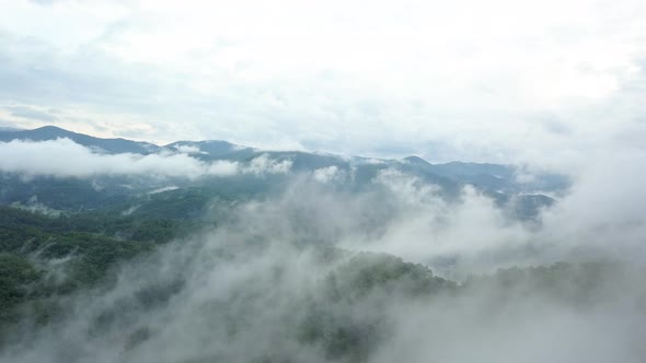 Rising Through The Clouds Over Mountains 4K