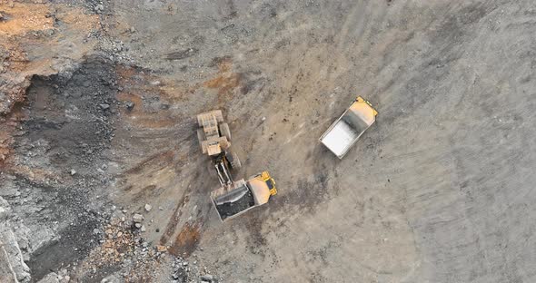 Open Pit Mining of Loading the Stone Gravel Into Heavy Dump Truck at the Opencast Mining