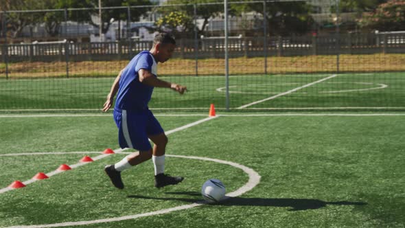 Soccer player training on field