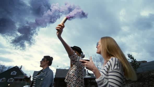 Three Hipsters Dance Outdoors with Flare