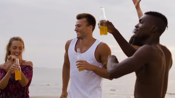 Happy Friends Dancing at Summer Beach Party 