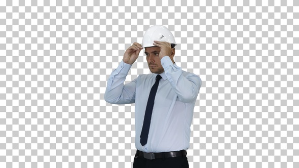 Businessman putting hardhat helmet on Safety, Alpha Channel