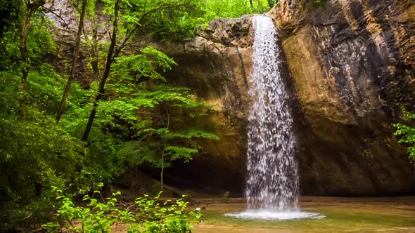 Waterfall and Cave in the Forest