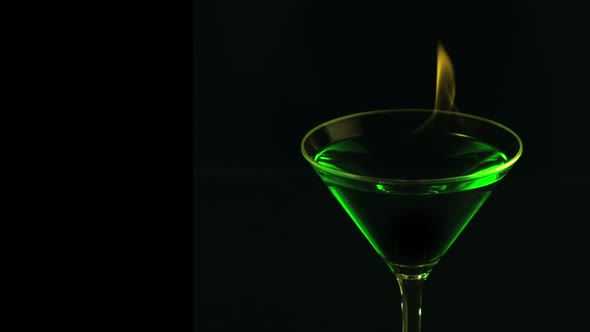 Fire blowing out of martini glass, Slow Motion