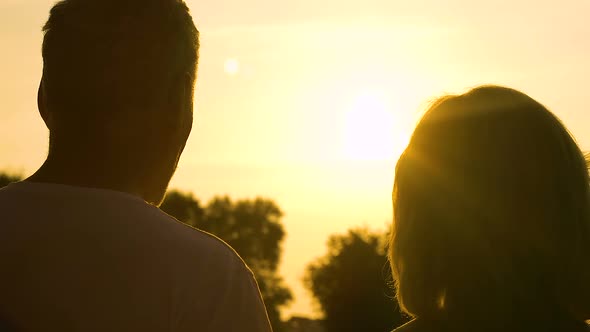 Happy Old Couple Enjoying Beautiful Romantic Evening and Sunset Outdoors