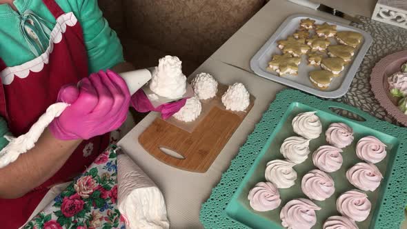 A Woman Prepares Marshmallow Cones. Ready Made Sweets Are Laid Out On Trays. Close Up Shot..