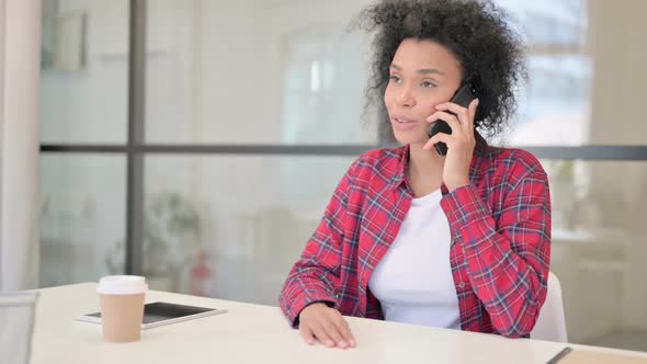 African Woman Talking on Phone