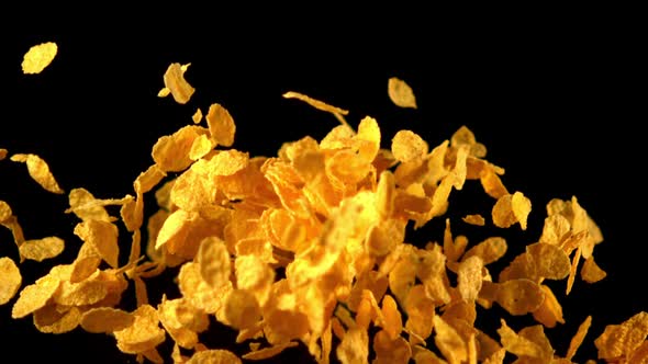 Super Slow Motion Cornflakes Take Off Against a Black Background