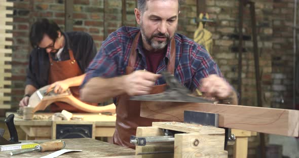 Cabinet Maker Planes the Beech Wood, Preparing it for Future Work