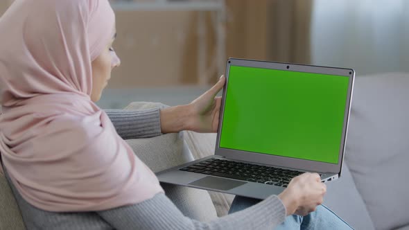 Over Shoulder Business Woman Freelancer Islamic Arabian Girl Sit on Cozy Sofa Using Laptop with Mock